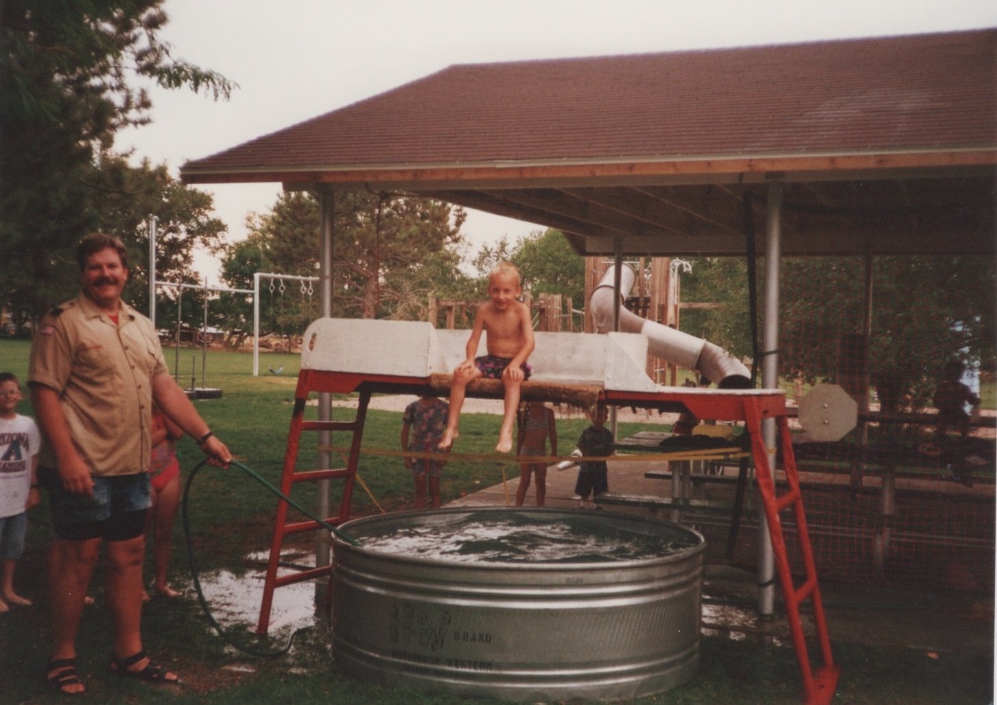 Me sitting above a pool of water on a dunking machine